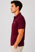 Rare Mode men’s White 240 GSM bio-washed cotton polo t-shirt side view with small chest logo