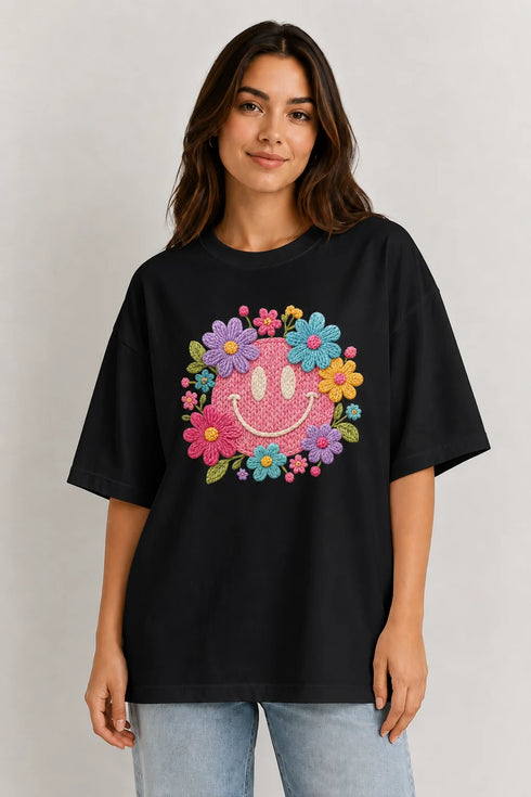 Women's floral smiley premium cotton oversized T-shirt in black - front